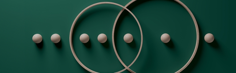 Dark green background showing a Venn Diagram of circles surrounding spheres.